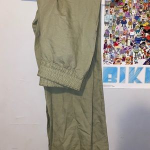 Very lightweight pant. Lighter color green in person. Very long as long pant